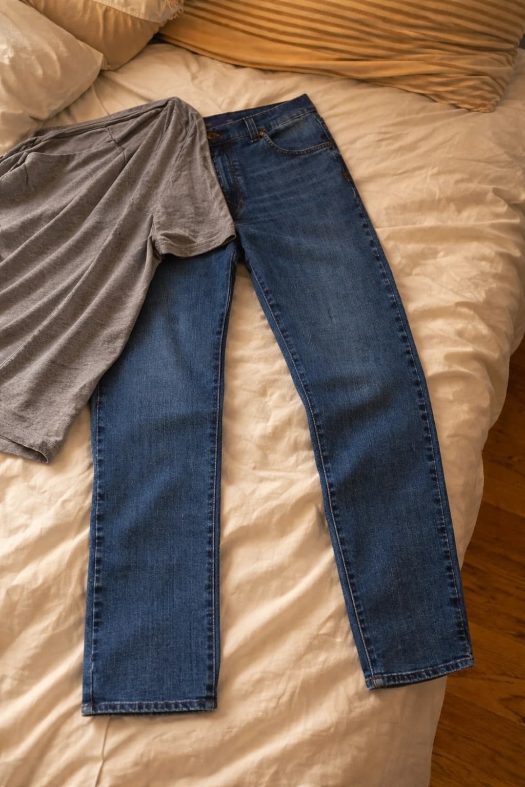 Poor garment example showing jeans partially covered by another garment